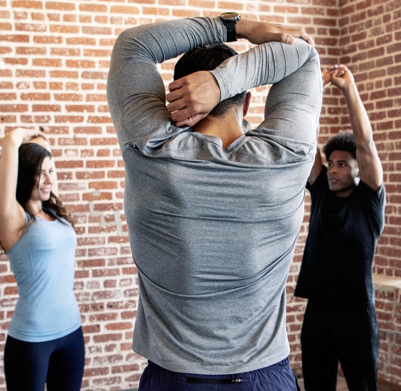 People stretching in a yoga studio