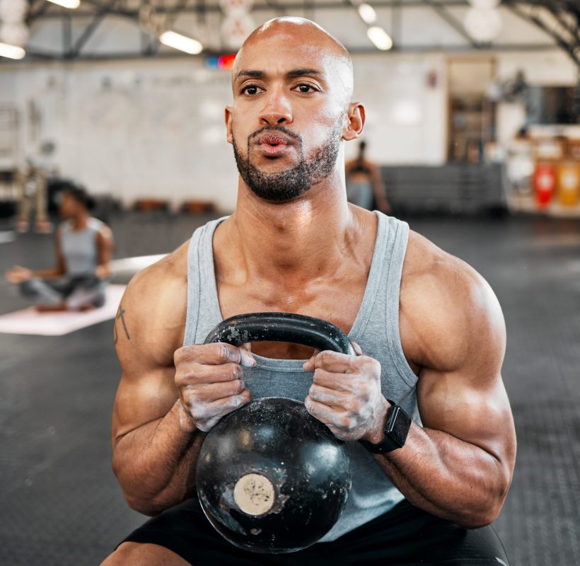 Your fitness journey is personal to you. Shot of a man completing squats with a kettlebell