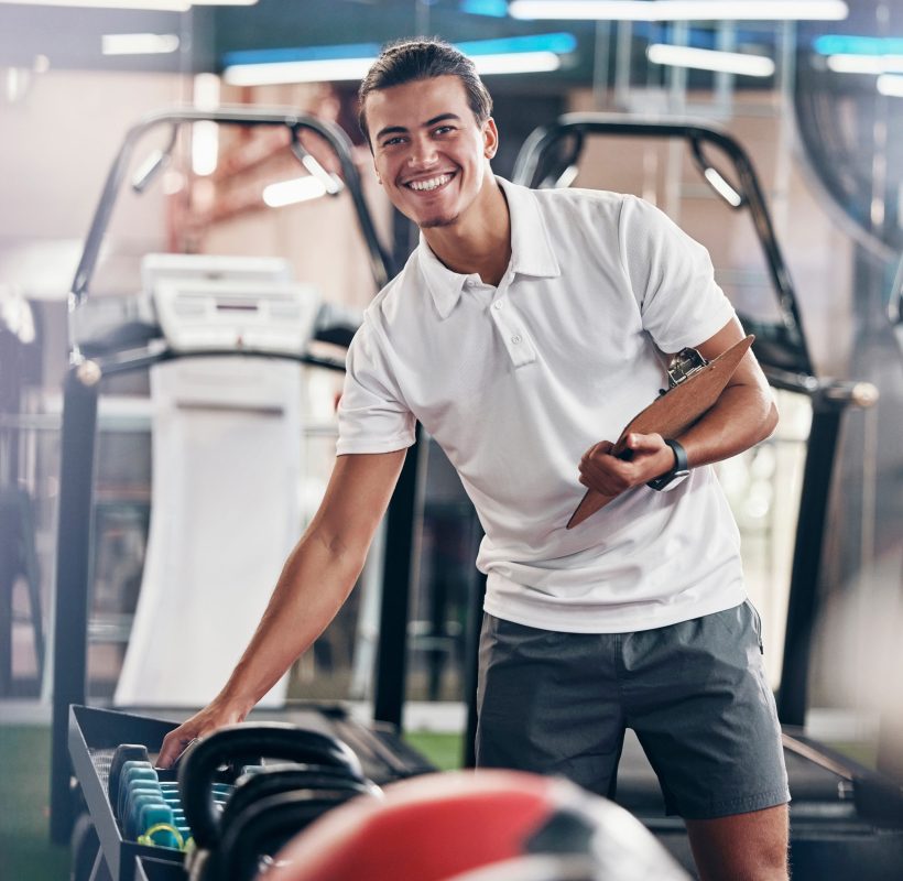 Training, portrait and fitness coach doing inspection of equipment at the gym. Wellness, sport and .